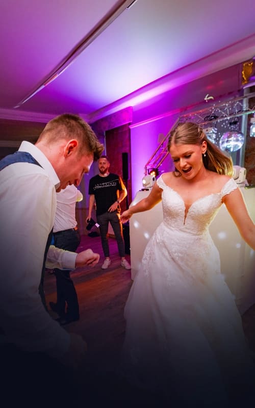 A bride and groom dancing their first dance at a wedding